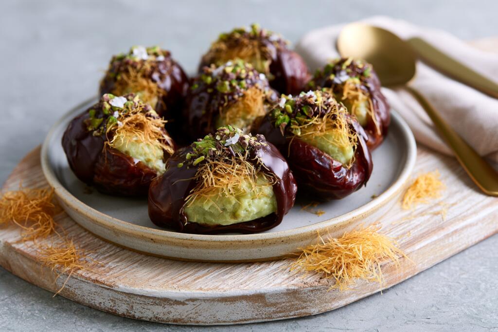 Plated Dubai chocolate protein stuffed dates with pistachio kataifi filling and dark chocolate
