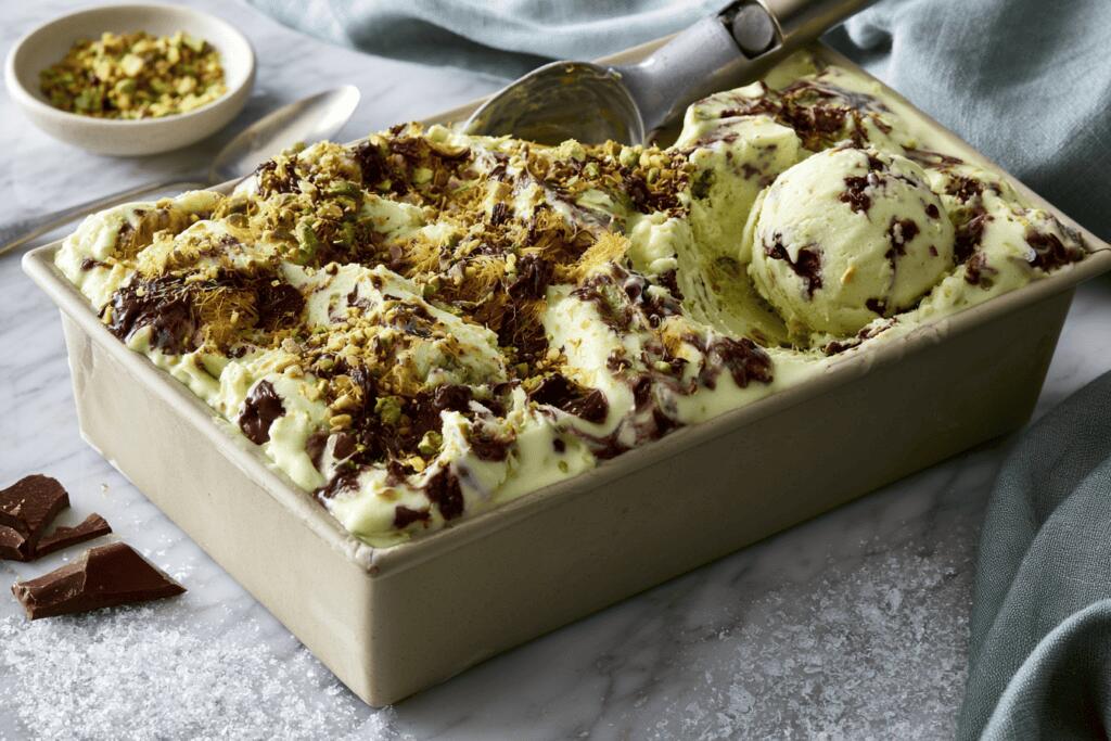  Scoopable Dubai chocolate pistachio gelato in a loaf pan with one scoop removed
