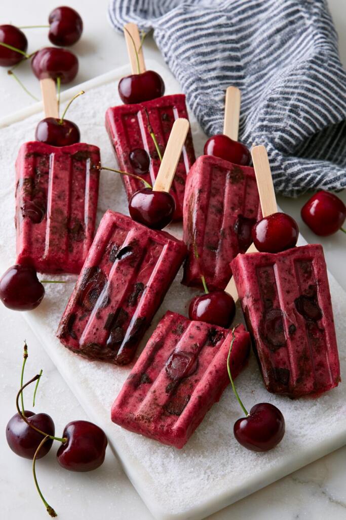 VIRAL cherry protein popsicles with dark chocolate flecks and whole cherries — high-protein Black Forest summer dessert